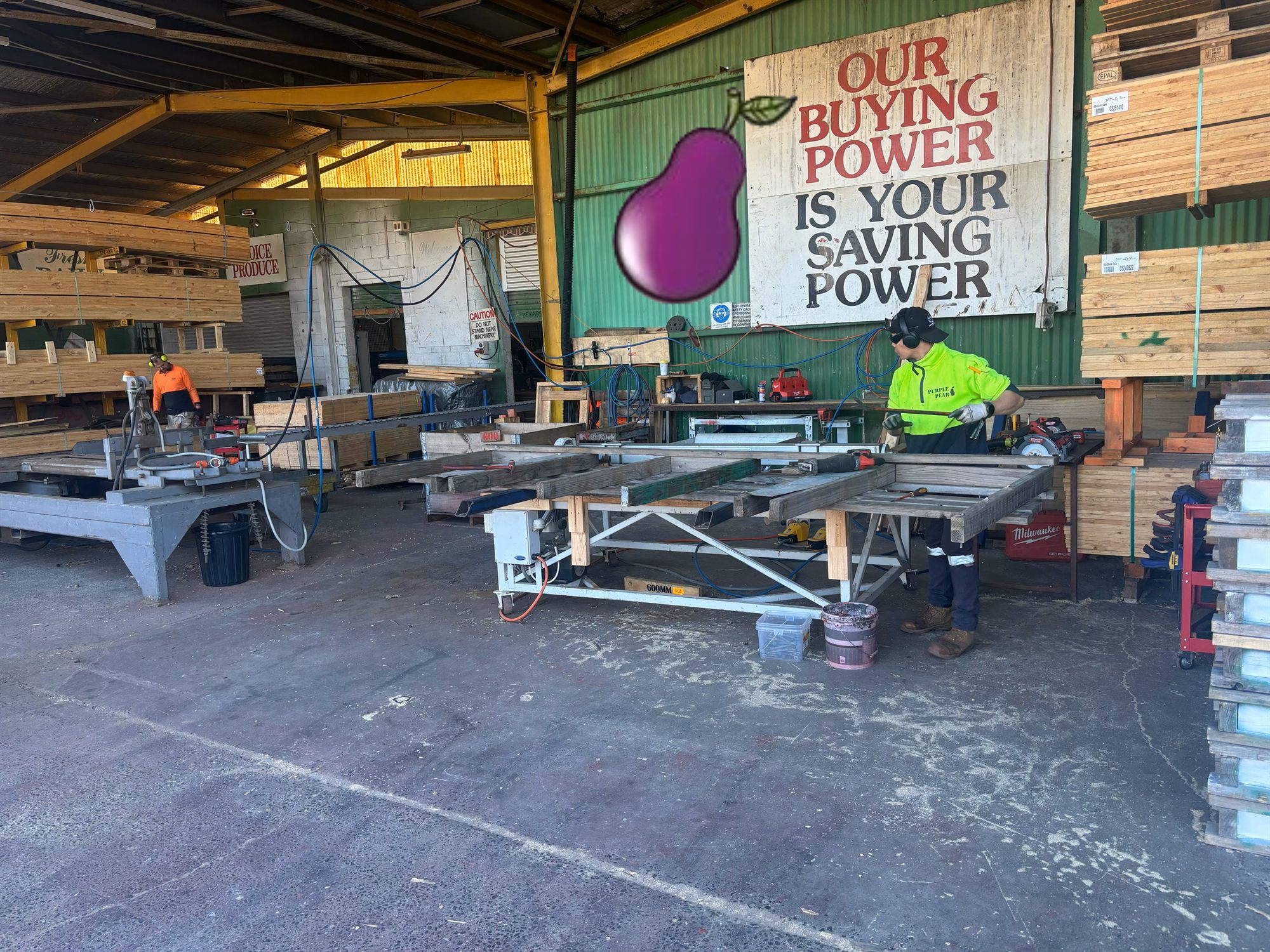 Purple Pear Pallets team repairing timber pallets in the Melbourne workshop